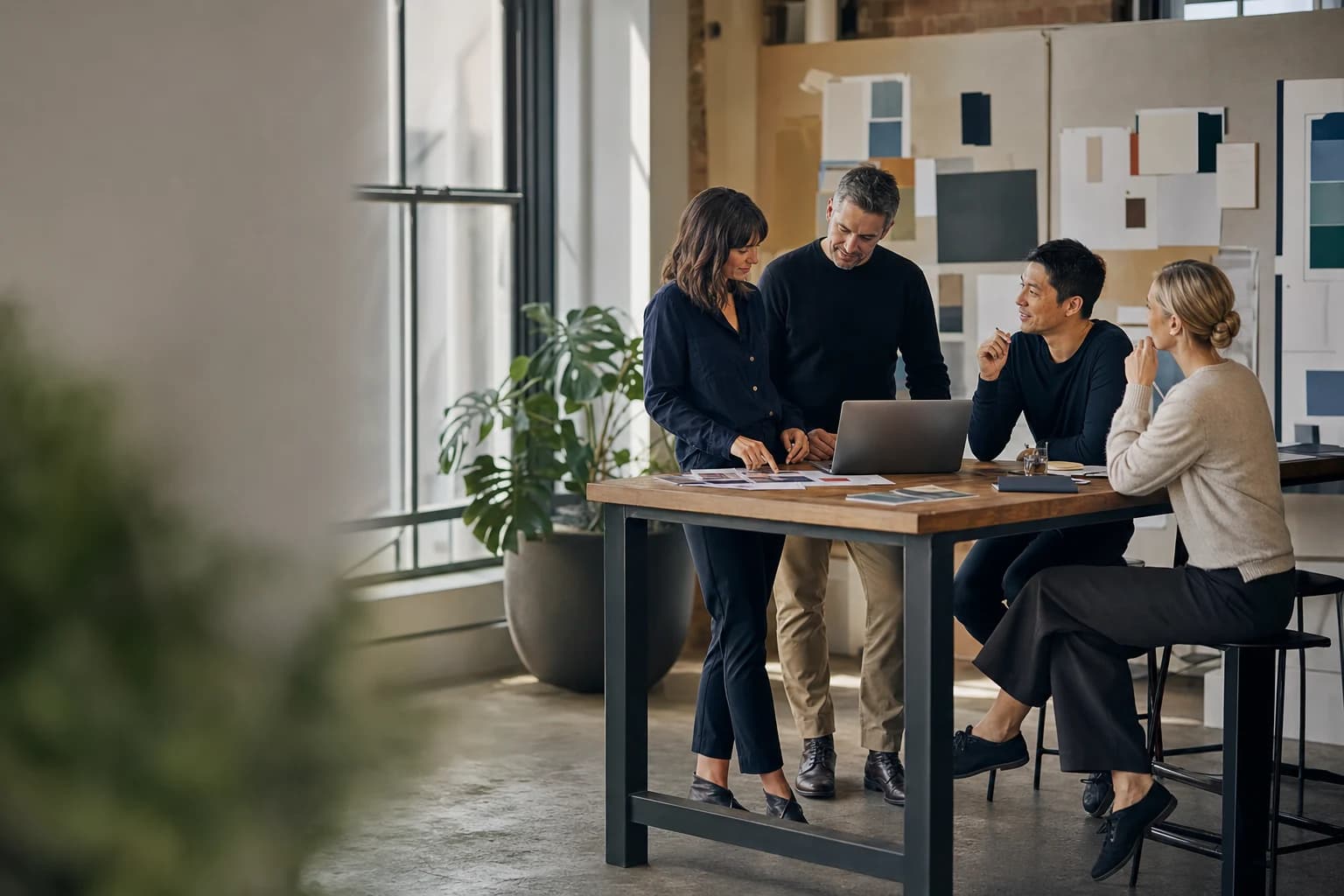 Marketing and communications team collaborating in a bright open-plan creative studio in Melbourne